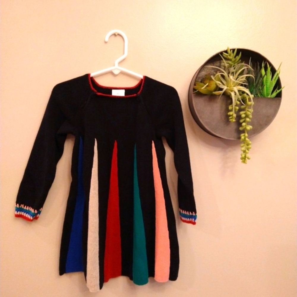 Hanna Andersson black sweater dress with colorful inset panels and crochet cuffs